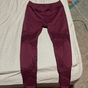 Fabletics leggings. Medium, Maroon color with fishnet type style in the legs.